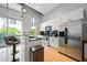 Modern kitchen featuring stainless steel appliances, a breakfast bar, and ample natural light at 44 Peachtree Nw Pl # 528, Atlanta, GA 30309