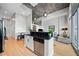 Open concept kitchen and living area with natural light and hardwood floors throughout at 44 Peachtree Nw Pl # 528, Atlanta, GA 30309