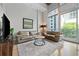 Contemporary living room featuring floor-to-ceiling windows and stylish decor at 44 Peachtree Nw Pl # 528, Atlanta, GA 30309