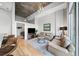 Bright living room with hardwood floors, concrete ceiling, and modern furnishings at 44 Peachtree Nw Pl # 528, Atlanta, GA 30309
