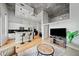 Open-concept living area with eat-in kitchen, hardwood flooring, and modern decor at 44 Peachtree Nw Pl # 528, Atlanta, GA 30309