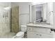 Modern bathroom with a glass enclosed shower and granite vanity at 5422 Heyward Square Pl, Marietta, GA 30068