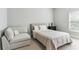 Cozy bedroom with neutral tones, comfortable queen-sized bed, and ample natural light at 5422 Heyward Square Pl, Marietta, GA 30068