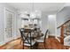 Bright dining area features a round table, stylish light fixture, and access to the kitchen at 5422 Heyward Square Pl, Marietta, GA 30068
