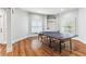 Finished basement game room features hardwood floors and a ping pong table for entertainment at 5422 Heyward Square Pl, Marietta, GA 30068