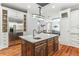Spacious kitchen with white cabinets, an island sink, and stainless steel refrigerator at 5422 Heyward Square Pl, Marietta, GA 30068