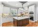 Gourmet kitchen with stainless appliances, custom cabinets, an island, and granite countertops at 5422 Heyward Square Pl, Marietta, GA 30068