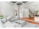 Bright living room featuring coffered ceiling, large windows, and comfortable seating at 5422 Heyward Square Pl, Marietta, GA 30068