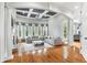 Spacious living room with hardwood floors, coffered ceilings, fireplace, and large windows at 5422 Heyward Square Pl, Marietta, GA 30068