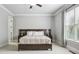 Serene main bedroom with a large window and neutral décor at 5422 Heyward Square Pl, Marietta, GA 30068