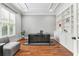 Home office with hardwood floors, built-in shelving, desk, and large window at 5422 Heyward Square Pl, Marietta, GA 30068