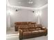 Finished basement features theater room with comfortable seating, perfect for movie nights at 5422 Heyward Square Pl, Marietta, GA 30068