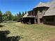 Expansive backyard featuring a manicured lawn and outdoor patio at 187 Slate Dr, Buford, GA 30518