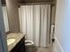 Bathroom featuring granite vanity, toilet, and shower with curtain at 187 Slate Dr, Buford, GA 30518