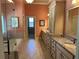 Spacious bathroom with double vanities, a soaking tub, a separate shower, and tile flooring at 187 Slate Dr, Buford, GA 30518