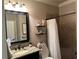 Bathroom featuring a tiled shower with a neutral colored shower curtain at 187 Slate Dr, Buford, GA 30518