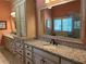 Spacious bathroom with double vanities, granite countertops, and large framed mirror at 187 Slate Dr, Buford, GA 30518