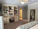 Comfortable bedroom featuring a ceiling fan, custom built-ins, and soft lighting, creating a relaxing and inviting space at 187 Slate Dr, Buford, GA 30518