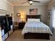Cozy bedroom featuring dark wood furniture, ample shelving, and natural light at 187 Slate Dr, Buford, GA 30518