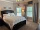 Bright bedroom featuring a comfortable bed with ample natural light at 187 Slate Dr, Buford, GA 30518