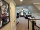 Bonus room is large with multiple seating areas, fan, and great decorations at 187 Slate Dr, Buford, GA 30518