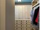 Custom closet featuring ample storage with drawers and cabinets for organized wardrobe solutions at 187 Slate Dr, Buford, GA 30518