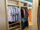 Organized closet with hanging rods and shelving for shoes and accessories, providing efficient storage solutions at 187 Slate Dr, Buford, GA 30518