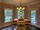 Charming dining area with a backyard view provides a cozy and inviting space for Gathering meals and gatherings at 187 Slate Dr, Buford, GA 30518