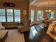 Sunlit dining area with large windows offers a view of the backyard, creating a pleasant dining experience at 187 Slate Dr, Buford, GA 30518