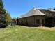 Brick home with a fenced yard, showcasing the architecture and landscaping at 187 Slate Dr, Buford, GA 30518