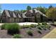Stunning brick home with a three-car garage, putting green, and meticulously landscaped front yard at 187 Slate Dr, Buford, GA 30518