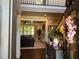 View of the foyer leading to a living room with fireplace and backyard view at 187 Slate Dr, Buford, GA 30518