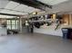 Organized garage with overhead storage and epoxy flooring, featuring storage solutions and ample space at 187 Slate Dr, Buford, GA 30518