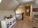 Upper hallway showcasing stylish furniture, neutral decor, and access to other rooms at 187 Slate Dr, Buford, GA 30518