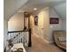 Upper hallway with plush carpet, neutral wall color, and views of other rooms at 187 Slate Dr, Buford, GA 30518