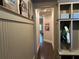 Hallway leading to a custom mudroom with built-in storage at 187 Slate Dr, Buford, GA 30518