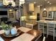 Bright kitchen features granite countertops, stainless appliances, and a view into the living area at 187 Slate Dr, Buford, GA 30518