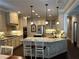 Well-appointed kitchen with granite countertops, stainless appliances, and island with seating at 187 Slate Dr, Buford, GA 30518