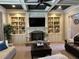 Relaxing living room showcases a coffered ceiling, built-in shelves and fireplace feature at 187 Slate Dr, Buford, GA 30518
