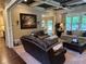 Spacious living room offering comfortable seating, with art and pass-through to other rooms at 187 Slate Dr, Buford, GA 30518