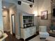 Cozy living area features built-in shelving, a stone fireplace, and elegant furnishings, creating a welcoming space at 187 Slate Dr, Buford, GA 30518
