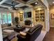 Inviting living room with coffered ceiling, built-ins, fireplace and comfortable seating at 187 Slate Dr, Buford, GA 30518