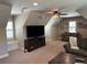 Large living room featuring comfortable seating, media center, and large windows with bright light at 187 Slate Dr, Buford, GA 30518