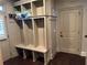 Mudroom with ample storage and adjacent exterior access door at 187 Slate Dr, Buford, GA 30518