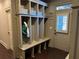 Mudroom with built-in storage and natural light creates a functional space at 187 Slate Dr, Buford, GA 30518