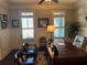 Bright office space featuring large windows with plantation shutters, desk and comfortable seating at 187 Slate Dr, Buford, GA 30518