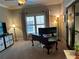 Spacious home office featuring neutral walls, carpeting, and natural lighting at 187 Slate Dr, Buford, GA 30518
