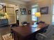 Tastefully decorated office featuring a large wood desk, wainscoting and decorative stadium artwork at 187 Slate Dr, Buford, GA 30518