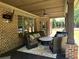 Covered patio with comfortable seating, ceiling fan, and outdoor TV at 187 Slate Dr, Buford, GA 30518