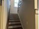 Staircase with wooden steps and rail combines comfort and style at 187 Slate Dr, Buford, GA 30518